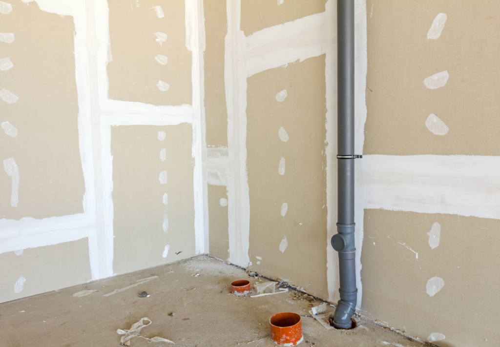 Builders ensuring compliance with Passive Fire Certification for a safe and legal project